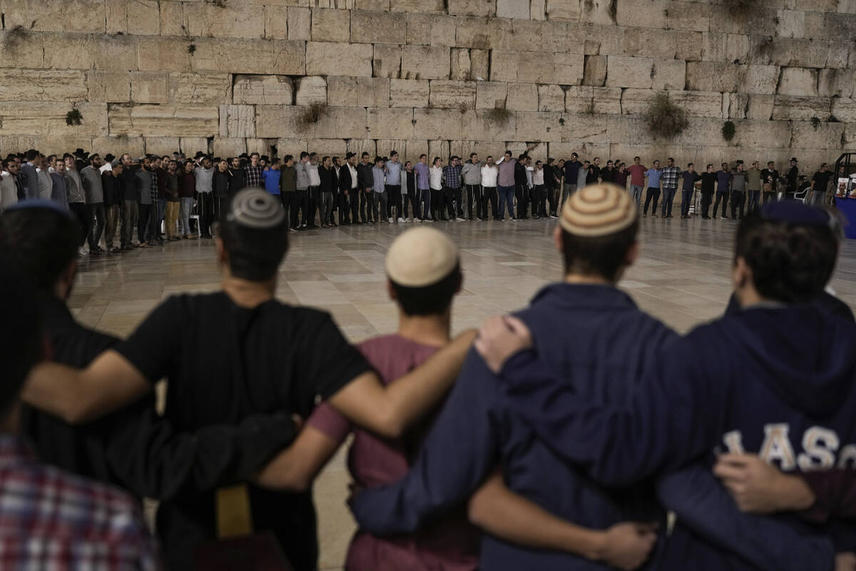 People attend a ceremony to mark the one-month anniversary of the bloody Oct. 7 cross-border at ...