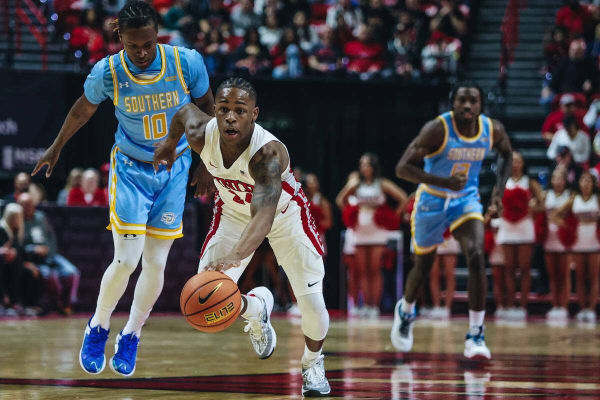 UNLV guard Jackie Johnson III (24) dribbles the ball across the court during a game against Sou ...