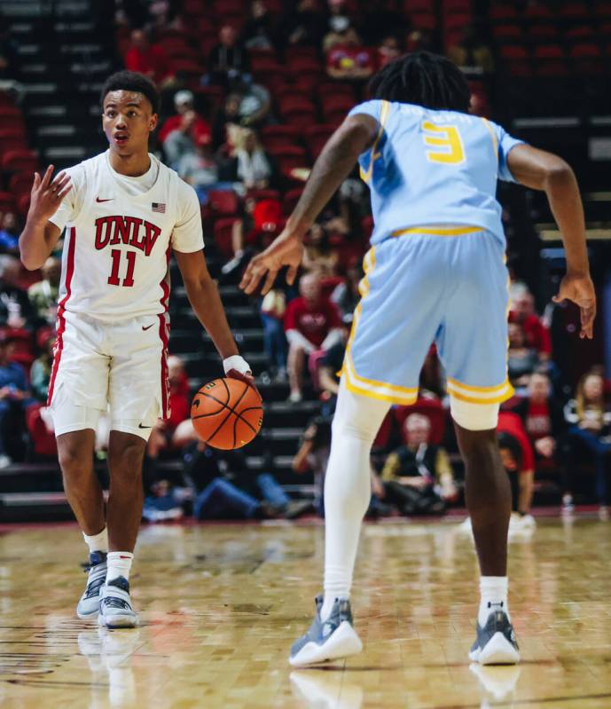 UNLV guard Dedan Thomas Jr. (11) signals to his teammate during a game against Southern at Thom ...