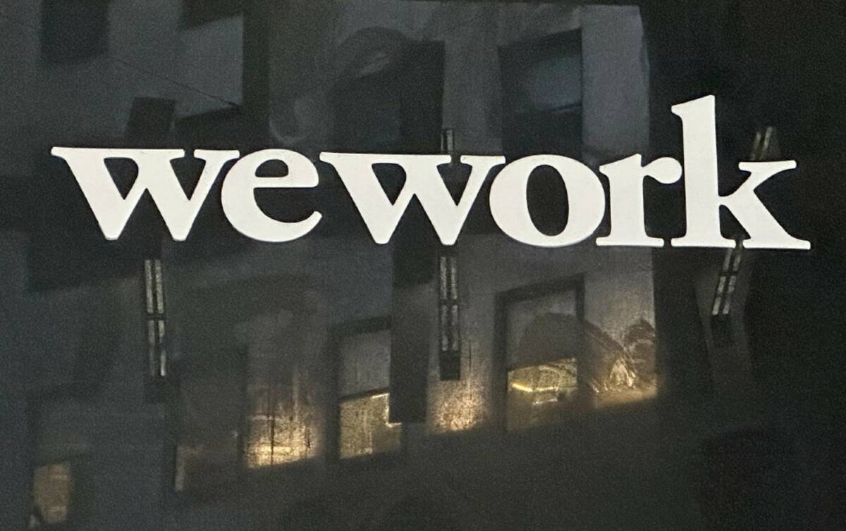 The WeWork logo appears on a building exterior in New York on Tuesday, Nov. 7, 2023. (AP Photo/ ...