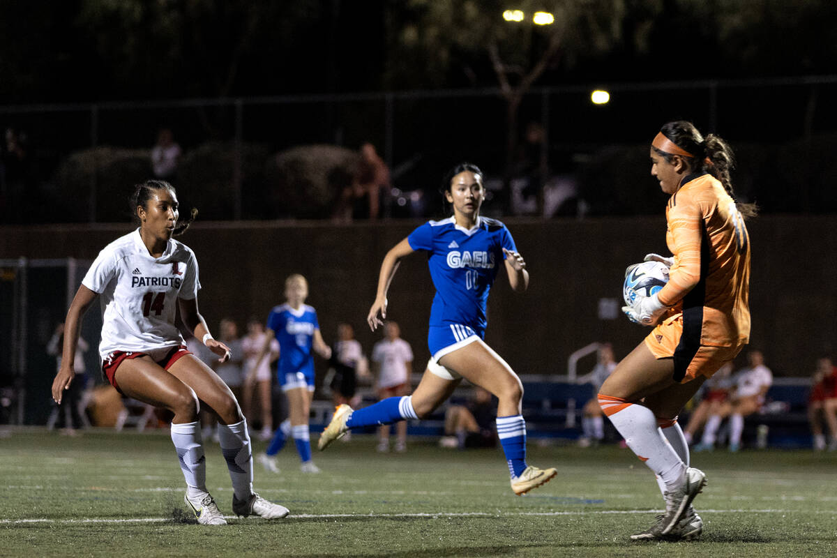 Bishop Gorman goalkeeper Laila Lazzara saves a shot by Liberty's Ayva Jordan (14) during a high ...