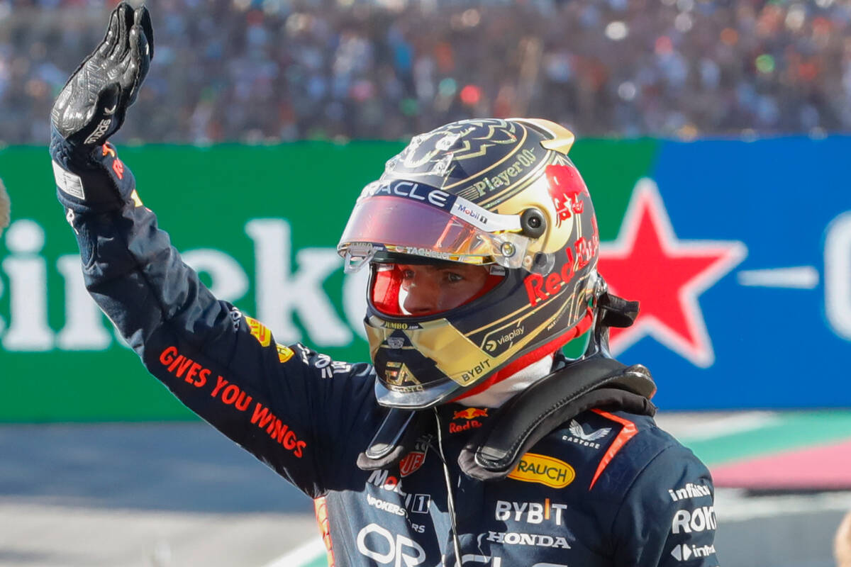 Red Bull driver Max Verstappen of the Netherlands waves after his first place sprint finish, a ...