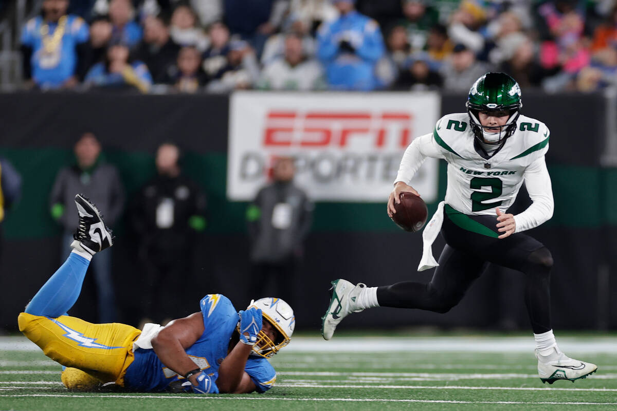 New York Jets quarterback Zach Wilson (2) looks to pass against the Los Angeles Chargers during ...