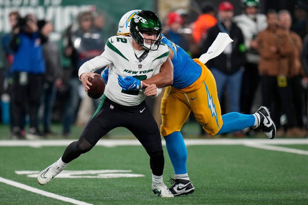 Los Angeles Chargers linebacker Tuli Tuipulotu (45) sacks New York Jets quarterback Zach Wilson ...