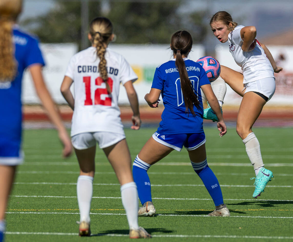 Coronado defender Kerrigyn Lynam (7) kicks the ball past Bishop Gorman defender Stephenie Hacke ...