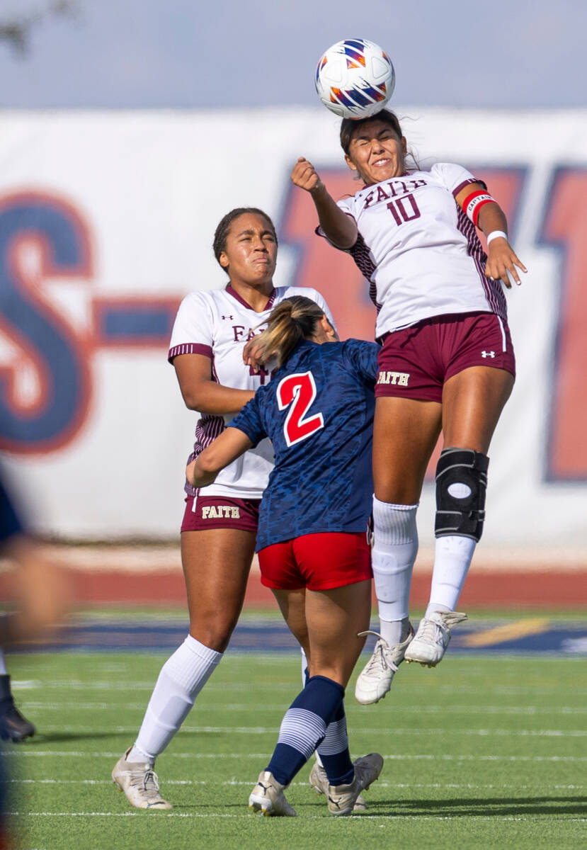 Faith Lutheran midfielder Andrea Levya (10) heads the ball above Liberty midfielder Natalie Col ...