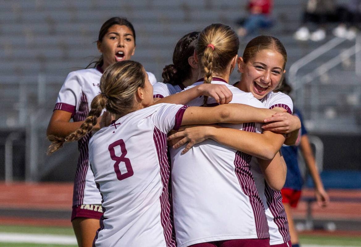 Faith Lutheran players celebrate a quick first goal against Liberty during the first half of th ...