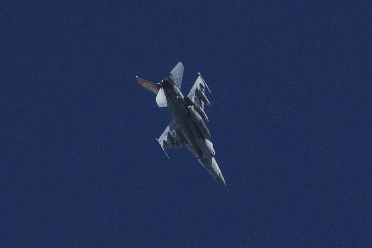 An Israeli jet fighter flies near the Gaza Strip, as seen from southern Israel, Friday, Nov. 10 ...