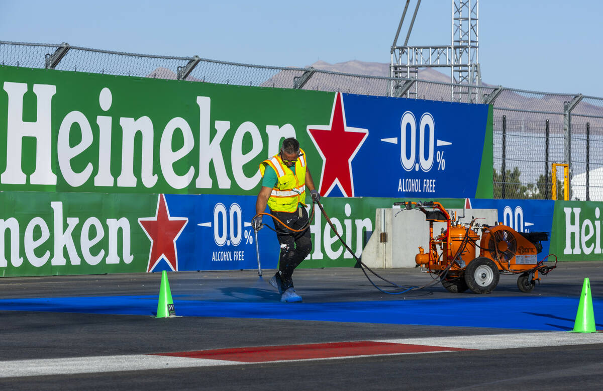 Turn one is painted with a logo about the Formula One Las Vegas Grand Prix pit building during ...