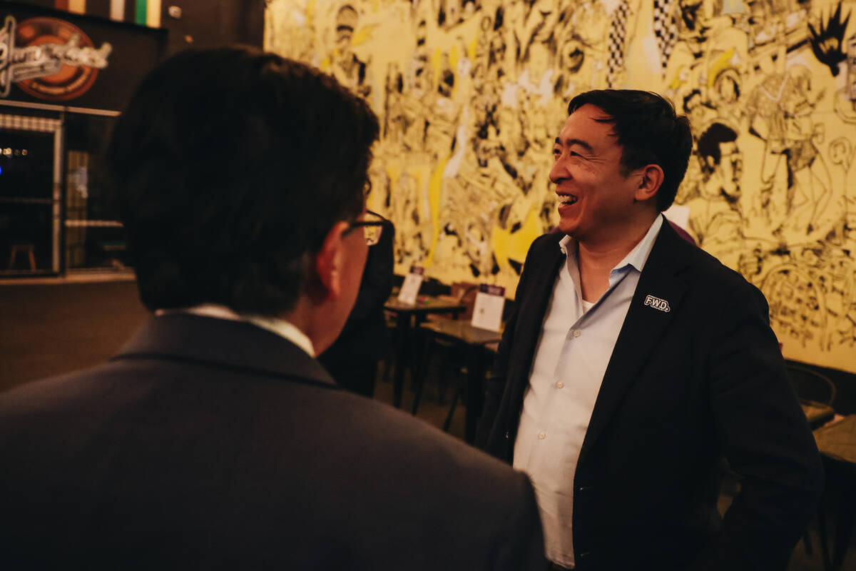 Andrew Yang, founder of the Forward Party, speaks to a supporter at a Forward Party event at Ja ...