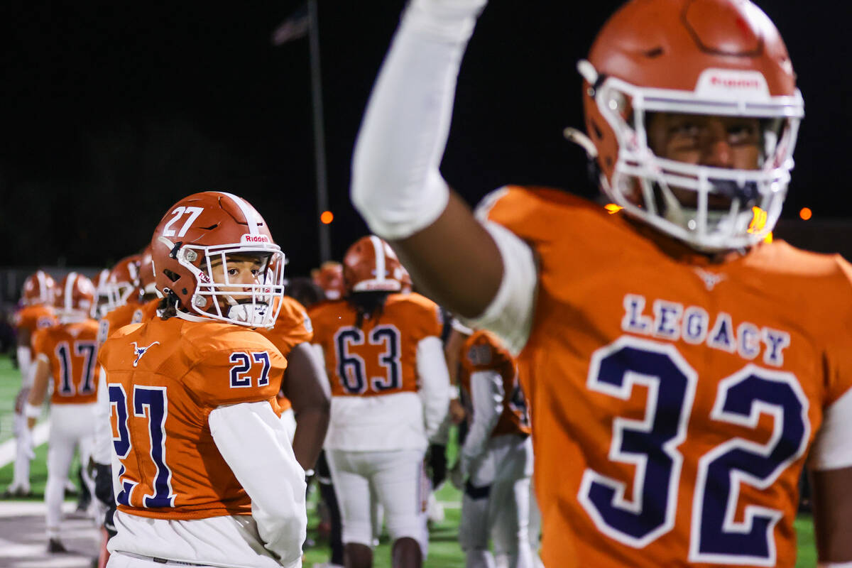 Legacy players celebrate a touchdown during the Class 5A Division III Southern League title foo ...