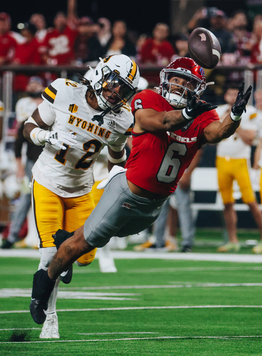 UNLV defensive lineman Naki Fahina (6) reaches to grab the ball during a game against Wyoming a ...