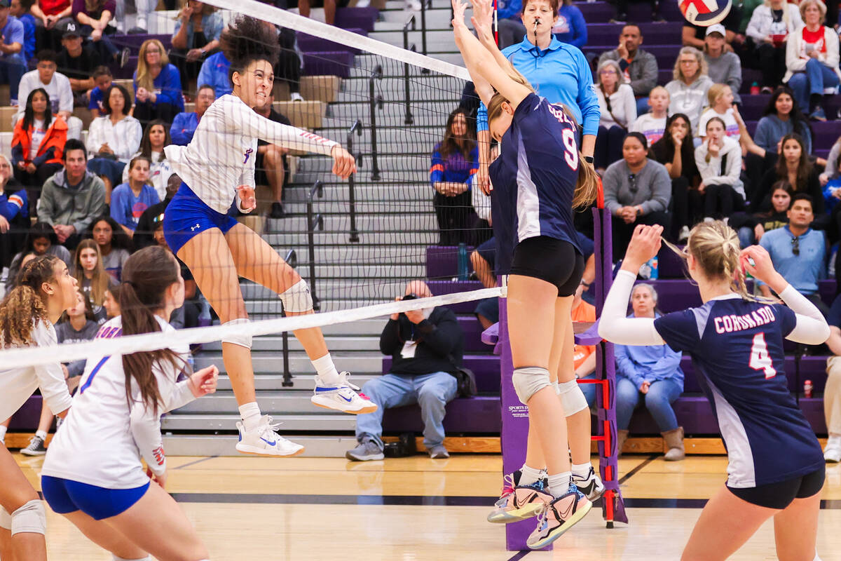 Bishop Gorman’s Ayanna Watson (4) spikes the ball against Coronado girls during the clas ...