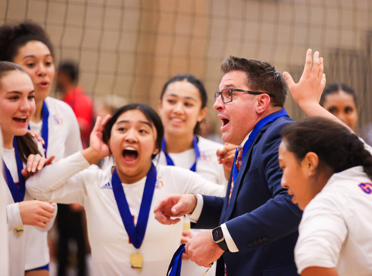 Bishop Gorman’s Head Coach Gregg Nunley celebrates alongside his team after Bishop Gorma ...