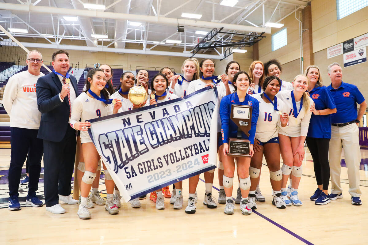 Bishop Gorman celebrates winning the class 5A girls volleyball state title match against Corona ...