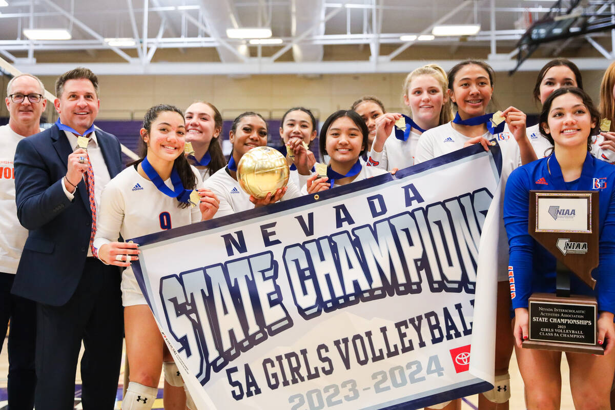 Bishop Gorman celebrates winning the class 5A girls volleyball state title match against Corona ...