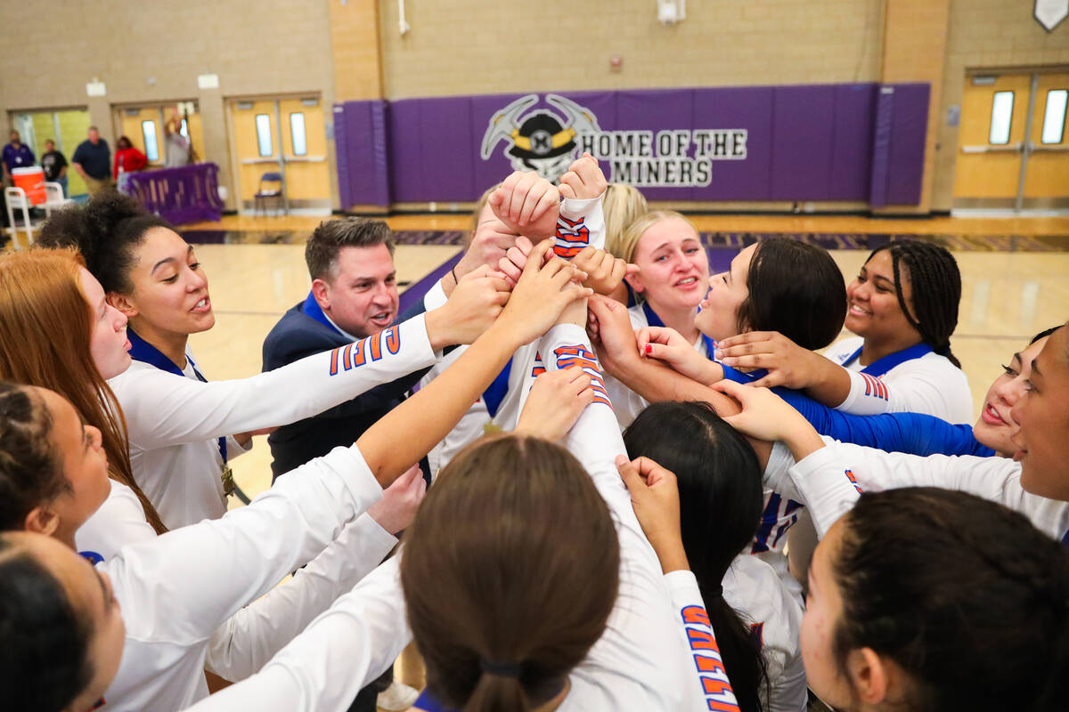 Bishop Gorman celebrates winning the class 5A girls volleyball state title match against Corona ...