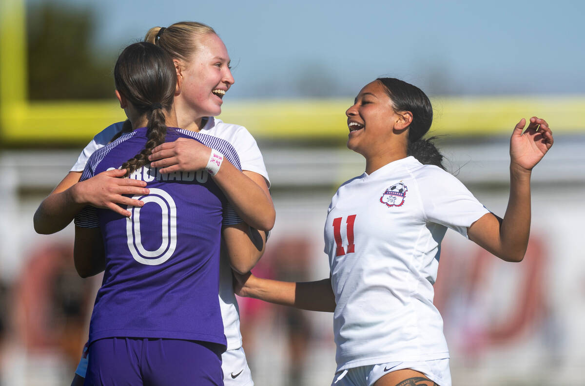 Coronado goalkeeper Megan Kingman (0), defenders Cate Gusick (20) and Tielua Baptista (11) cele ...