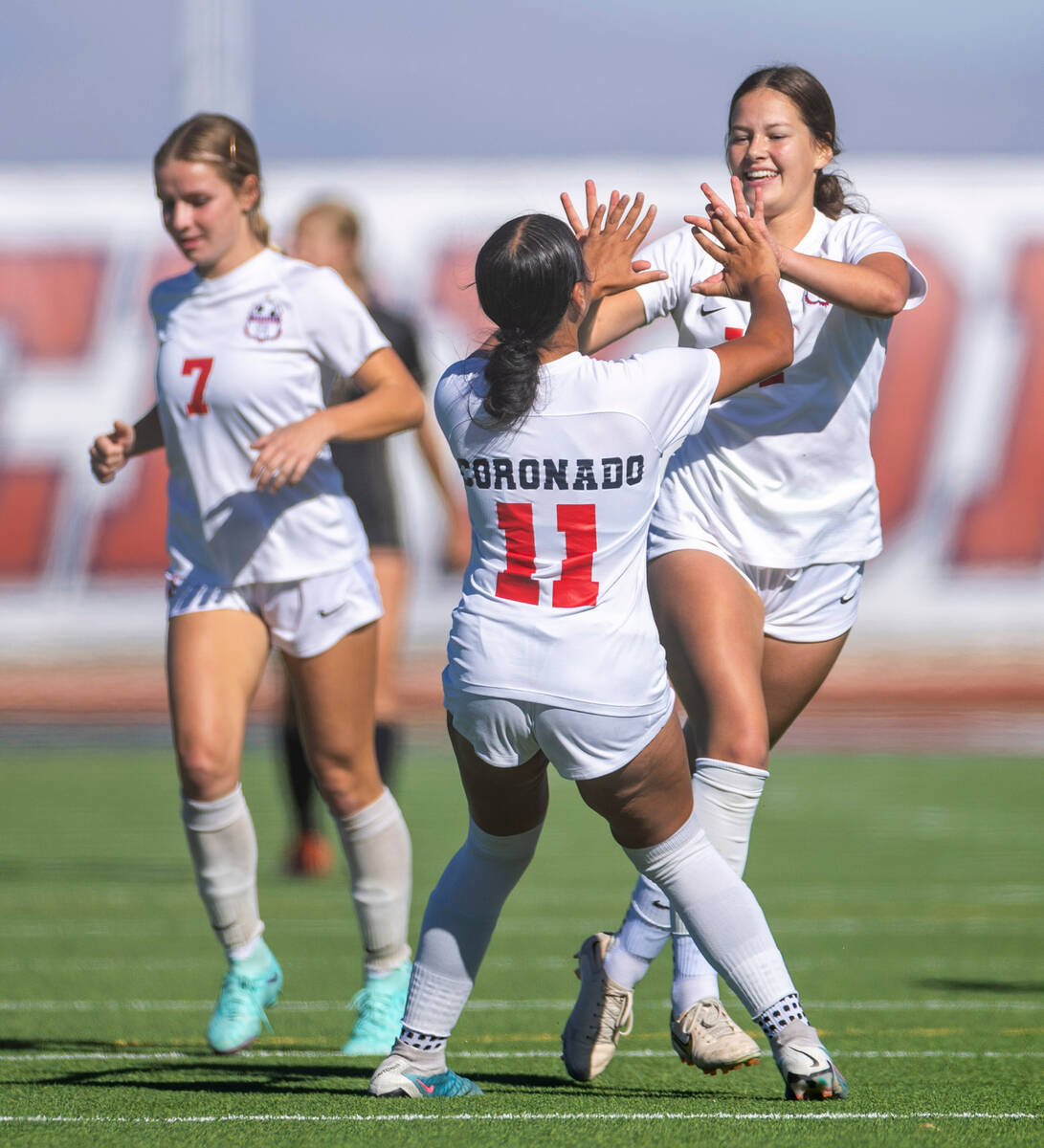 Coronado defender Tielua Baptista (11) celebrates their first goal with defender Ella Schultz ( ...