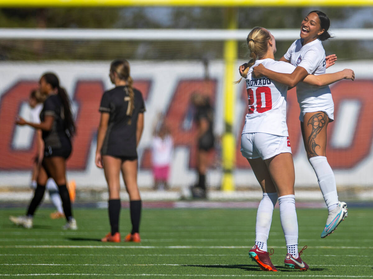 Coronado defenders Cate Gusick (20) and Tielua Baptista (11) celebrate their second goal agains ...