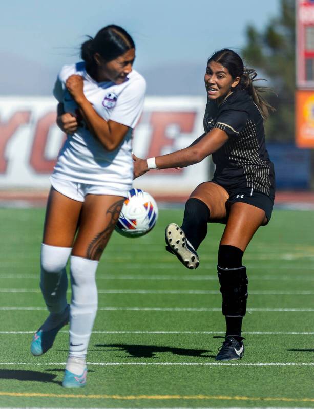 Faith Lutheran midfielder Andrea Leyva (10) kicks the ball against Coronado defender Tielua Bap ...