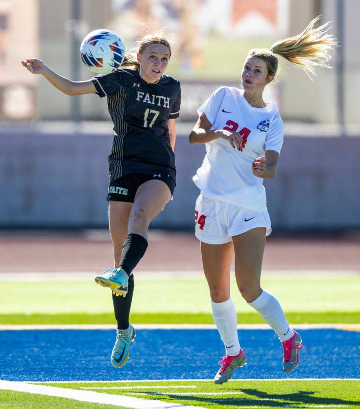 Faith Lutheran forward Julia Anfinson (17) kicks the ball clear of Coronado midfielder Aubrey W ...