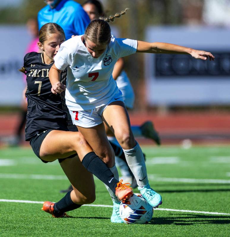 Coronado defender Kerrigyn Lynam (7) is tripped up while advancing the ball by Faith Lutheran m ...