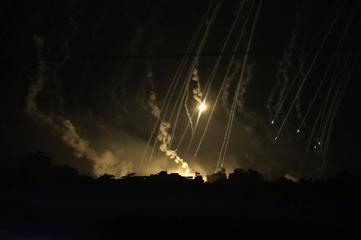 Smoke and flares rise during an Israeli strike in the Gaza Strip, as seen from southern Israel, ...