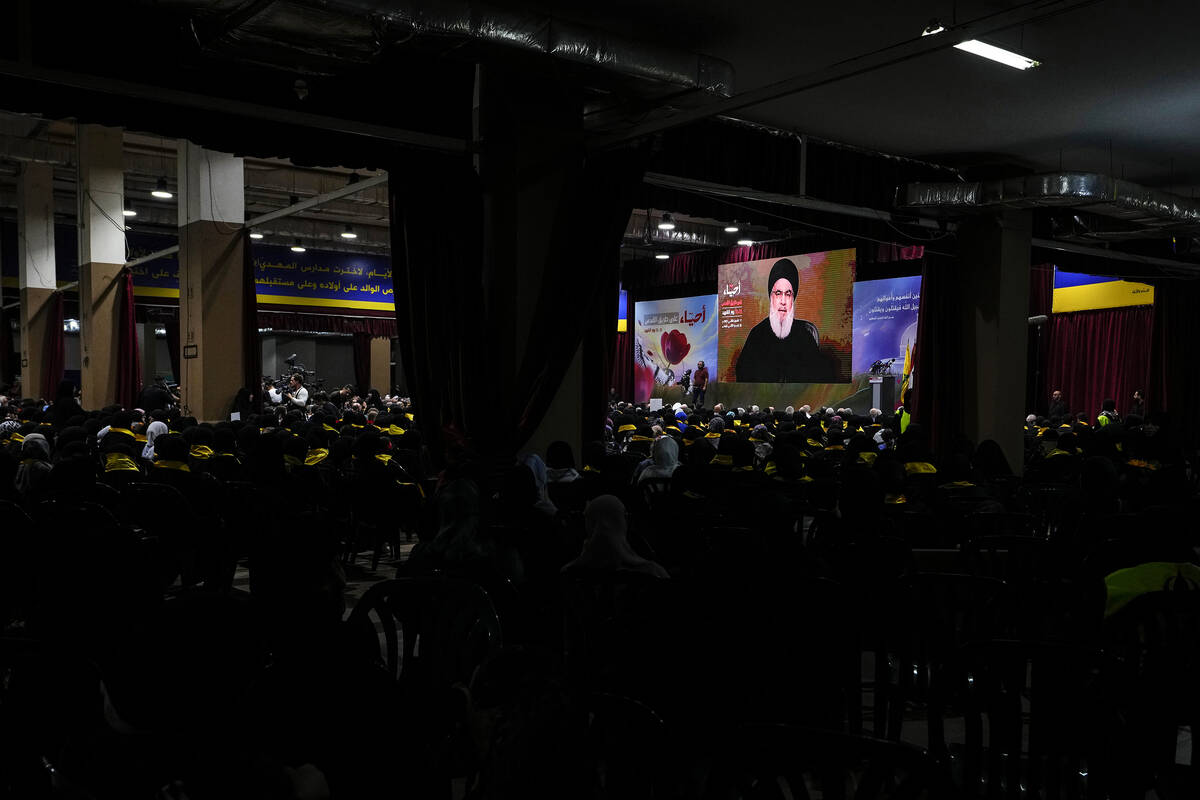Sayyed Hassan Nasrallah via a video link, shown speaking in the southern Beirut suburb of Dahiy ...