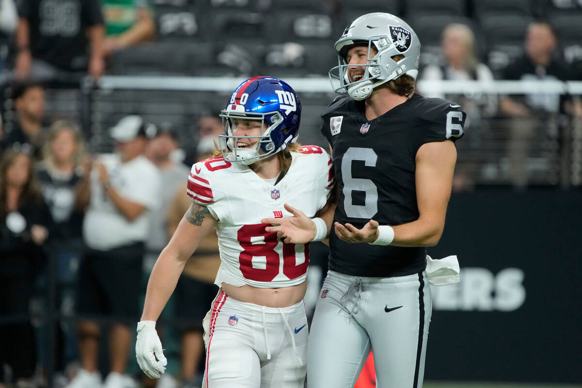 New York Giants wide receiver Gunner Olszewski (80) and Las Vegas Raiders punter AJ Cole (6) du ...