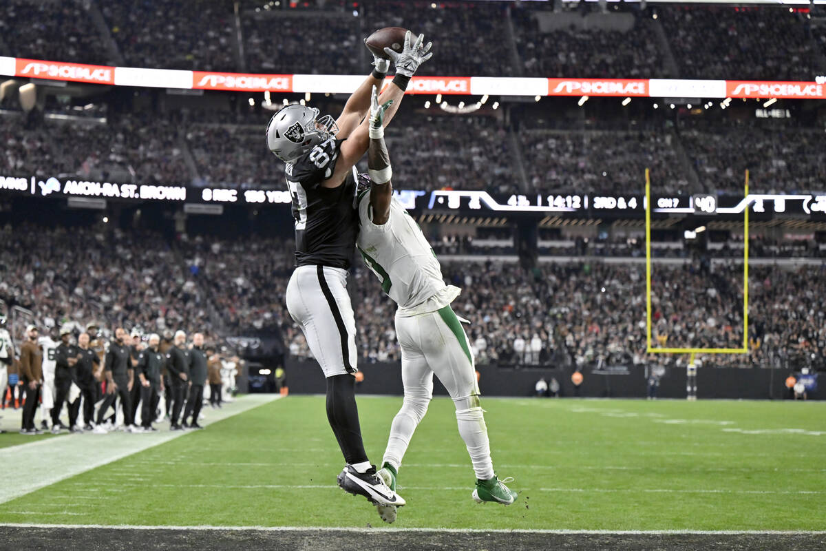 Las Vegas Raiders tight end Michael Mayer (87) catches a touchdown pass as New York Jets safety ...