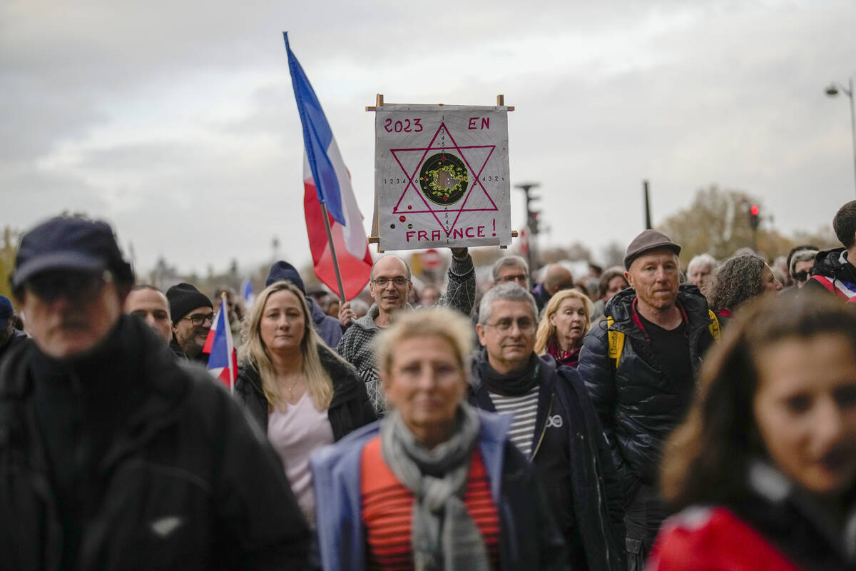 Thousands gather for a march against antisemitism in Paris, France, Sunday, Nov. 12, 2023. Fren ...