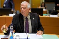 European Union foreign policy chief Josep Borrell rings a bell to signify the start of a meetin ...