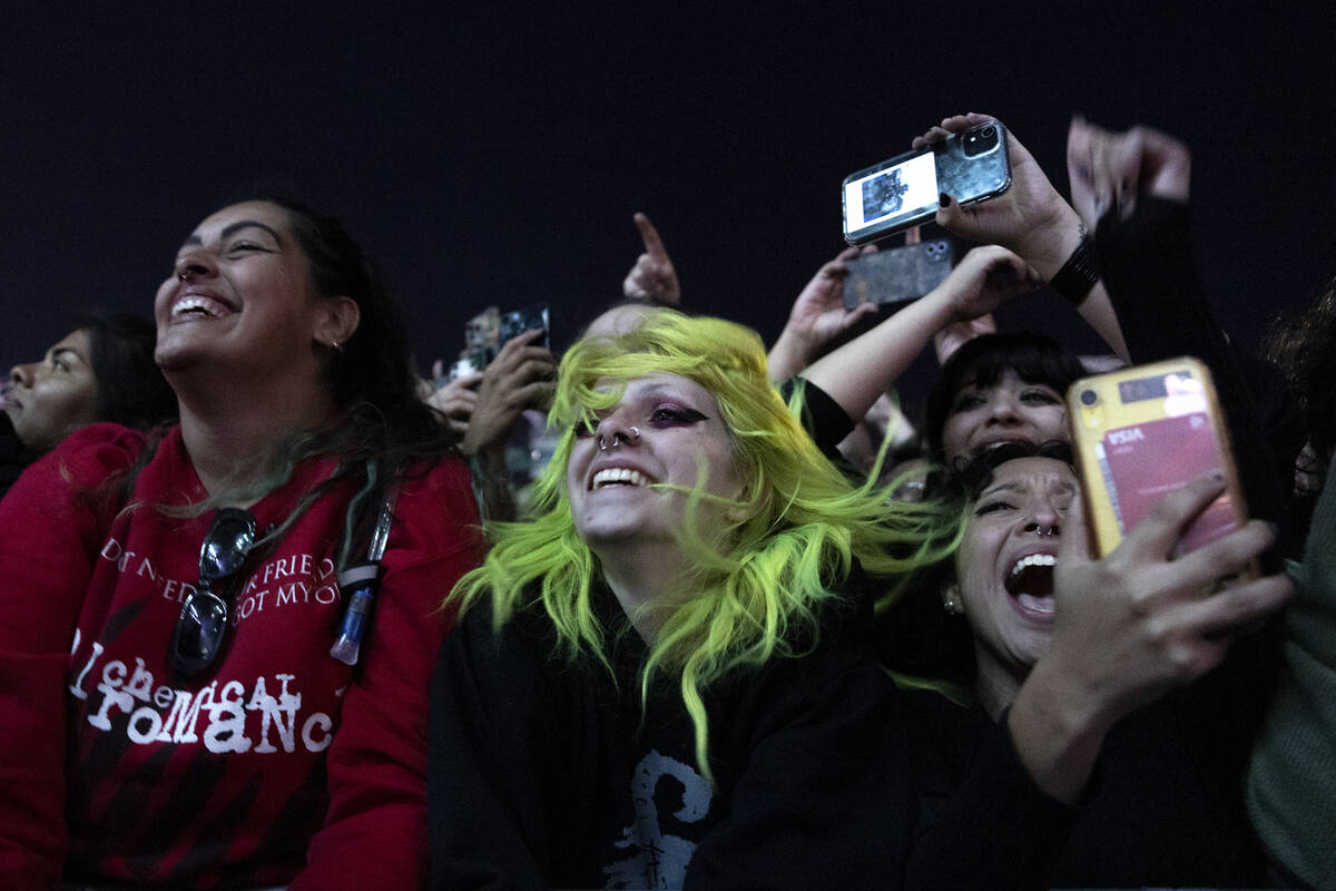 Fans sing and dance to My Chemical Romance while they play their song “I’m Not Okay (I Prom ...