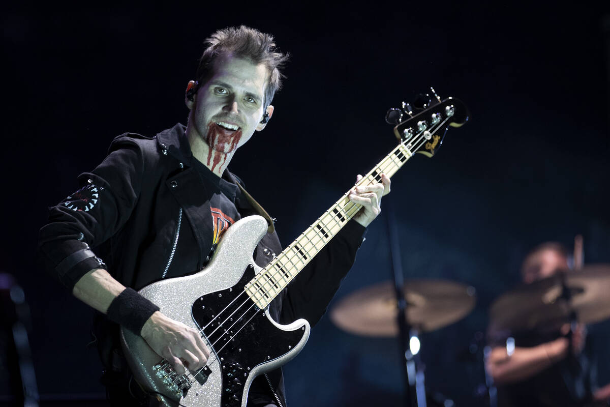 My Chemical Romance bassist Mikey Way performs the band’s headlining set during the When We W ...