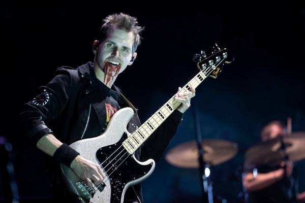 My Chemical Romance bassist Mikey Way performs the band’s headlining set during the When We W ...