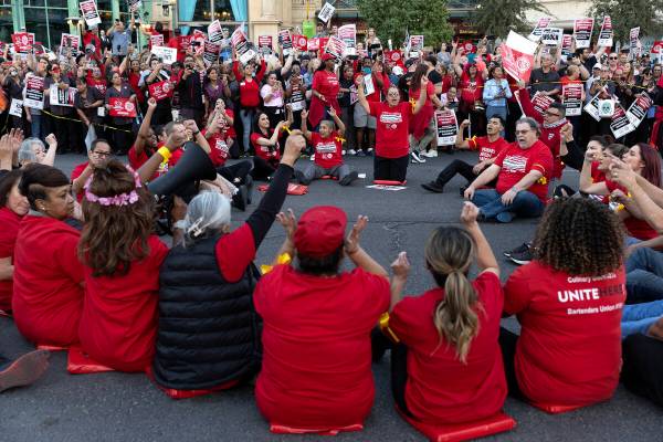 Culinary union members block Las Vegas Boulevard during a rally with thousands of fellow hotel ...