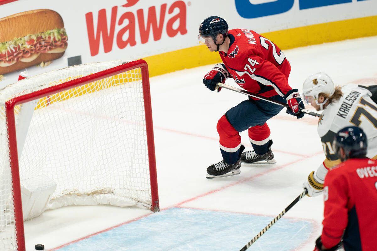 Washington Capitals center Connor McMichael (24) scores an empty-net goal in the third period o ...