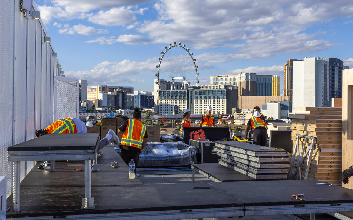 A construction crew continues the build on the rooftop of the Formula One Las Vegas Grand Prix ...