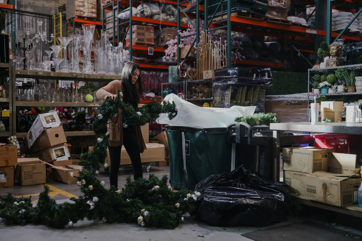 Sylvia Lopez, a survivor of addiction, disassembles a garland at her job as a florist at Destin ...