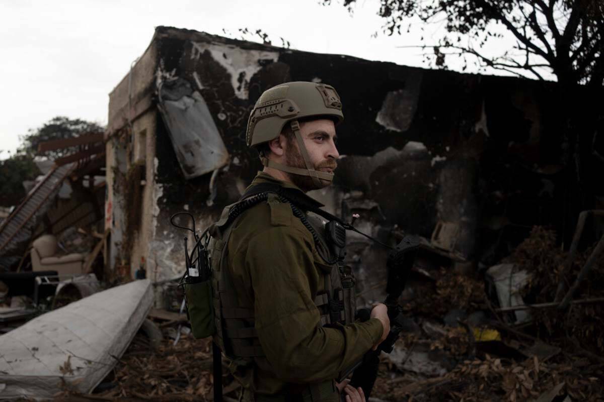 An Israeli soldier stands guard during a visit by former New Jersey Governor Chris Christie to ...
