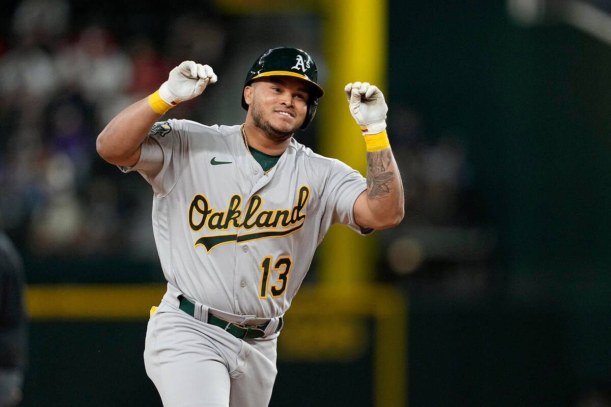 Oakland Athletics' Jordan Diaz looks to the dugout and celebrates his pinch-hit solo home run a ...