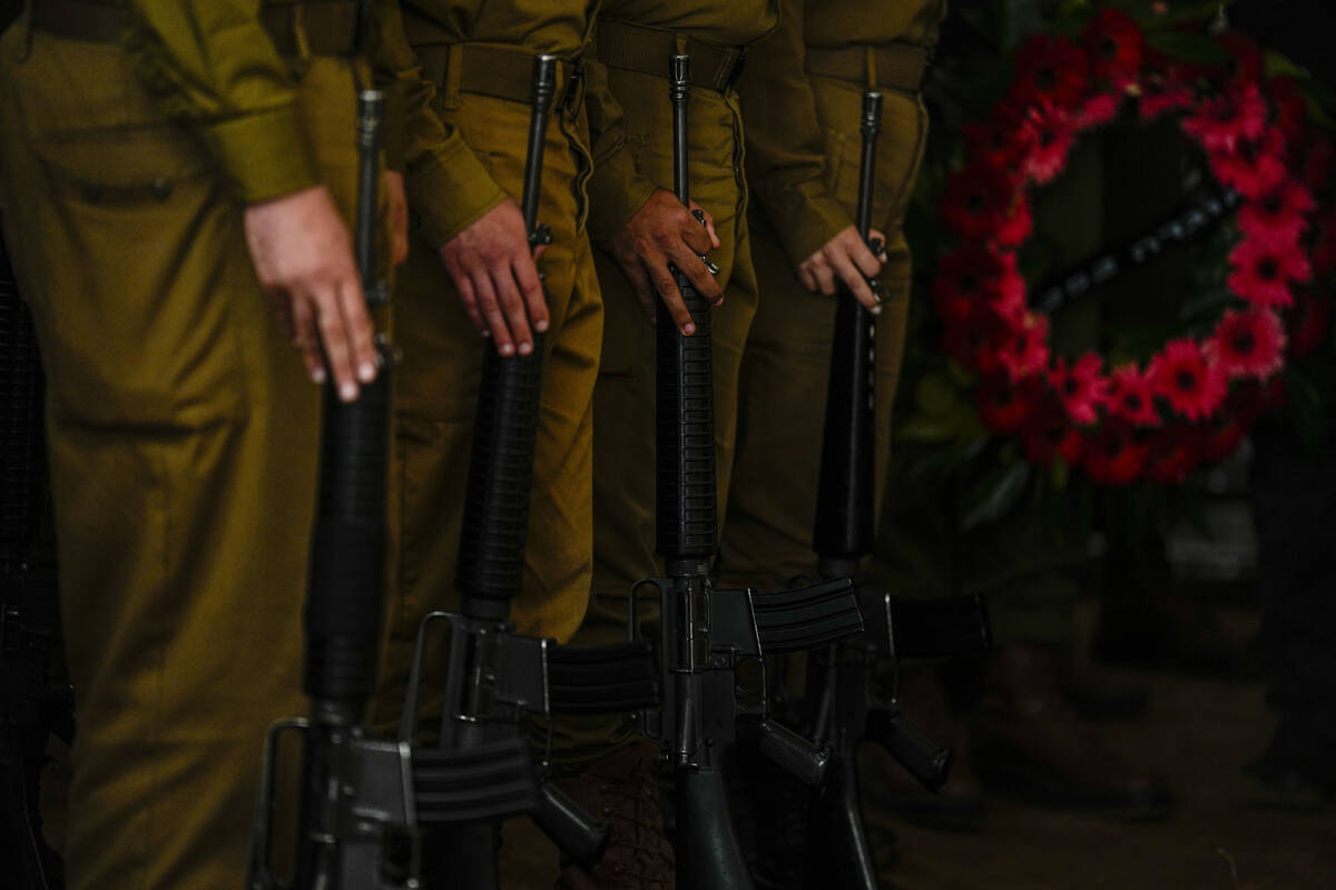 Israeli honor guard soldiers attend the funeral of Israeli reserve soldier Master sergeant Raz ...