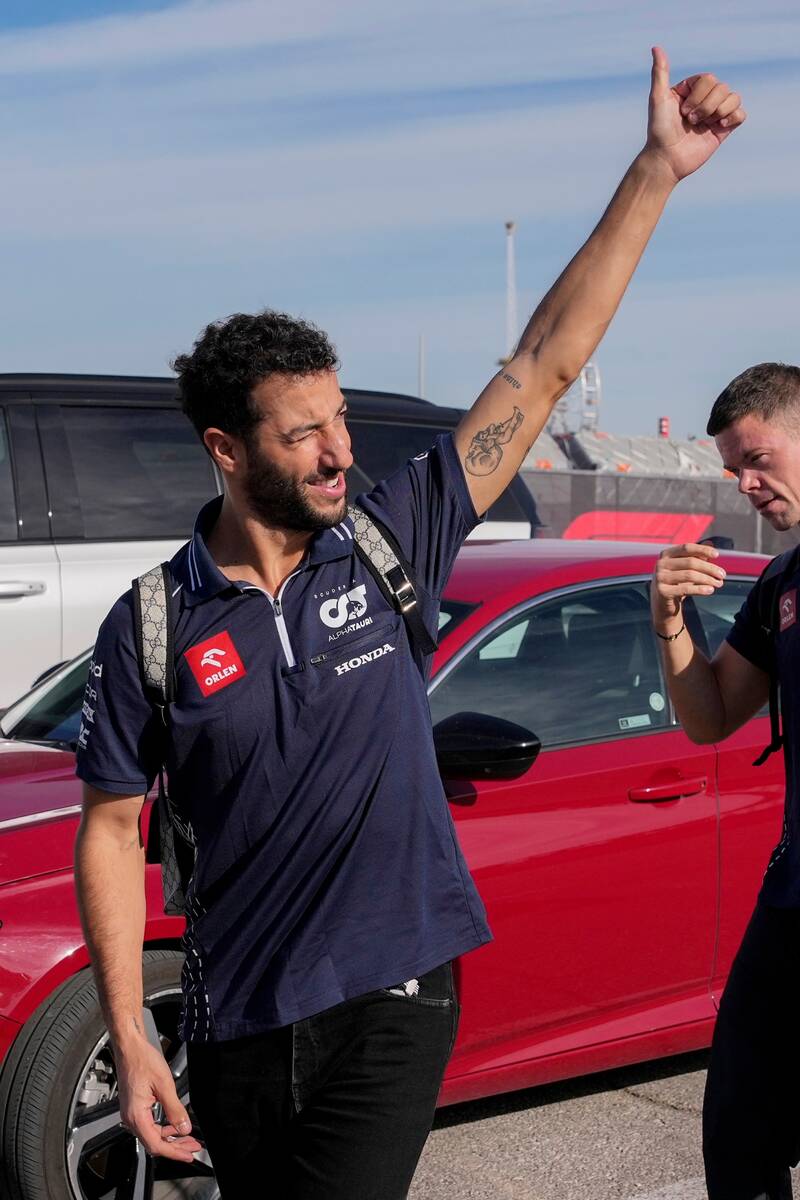 AlphaTauri driver Daniel Ricciardo, of Australia, gives the thumbs up to the crowd before the s ...