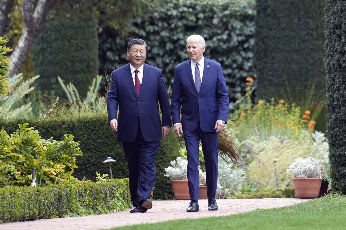 President Joe Biden and China's President President Xi Jinping walk in the gardens at the Filol ...