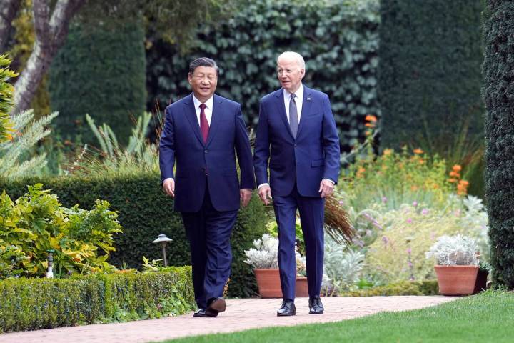 President Joe Biden and China's President President Xi Jinping walk in the gardens at the Filol ...