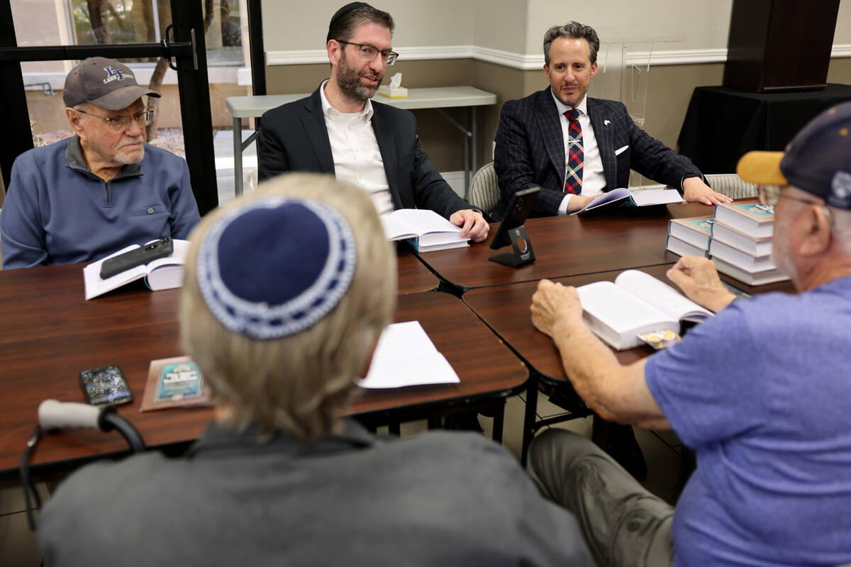 Rabbi Nachum Meth, right, participates in a class led by Rabbi Aryeh Goldman, second from right ...