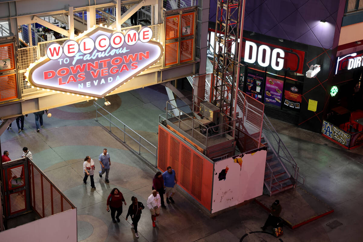 People walk through the Fremont Street Experience in downtown Las Vegas on Wednesday, Nov. 15, ...