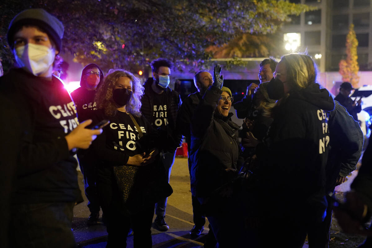 Protesters cheer outside the Democratic National Committee headquarters Wednesday, Nov. 15, 202 ...