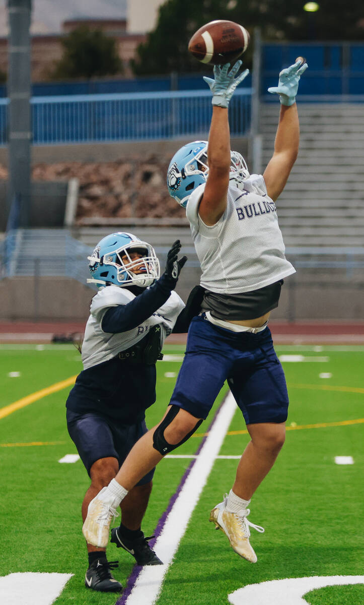 Centennial football players participate in a team practice at Centennial High School on Wednesd ...